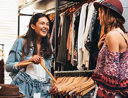 two young women shopping for clothes